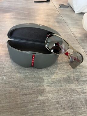 Prada Men’s Gray Aviator Sunglasses with Silver Frame and Gray Lenses